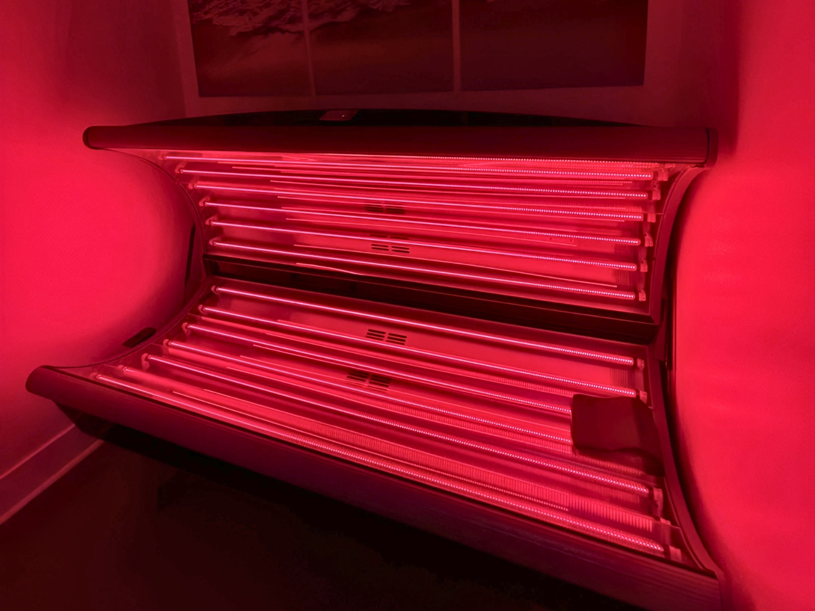 Red Light Therapy bed with red glow background from the red lights